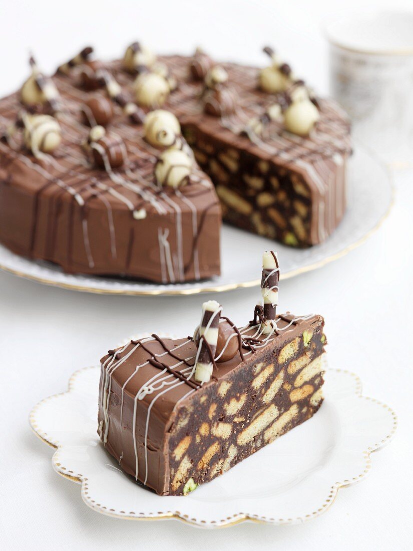 A sliced chocolate & biscuit cake
