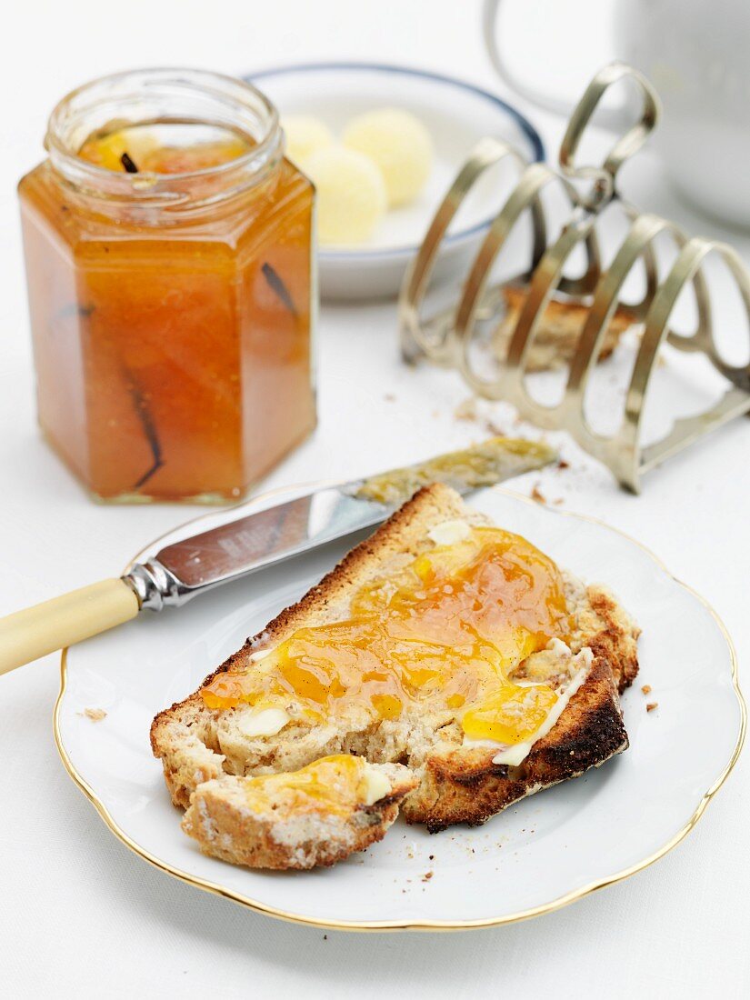 Buttered toast with jam made of dried apricots