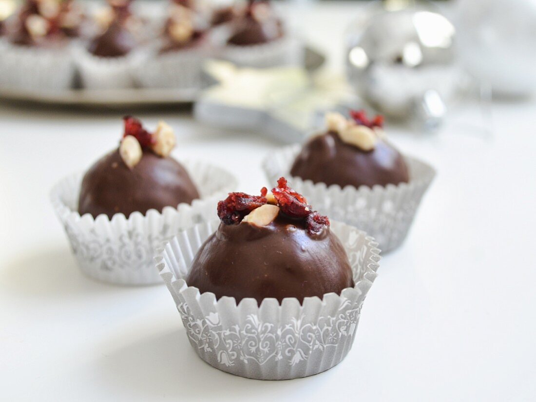Chocolate truffles with lingonberries and almonds