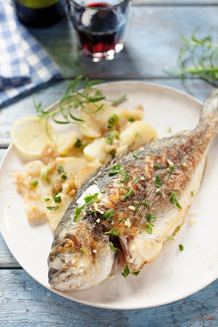 Porgy served with potatoes
