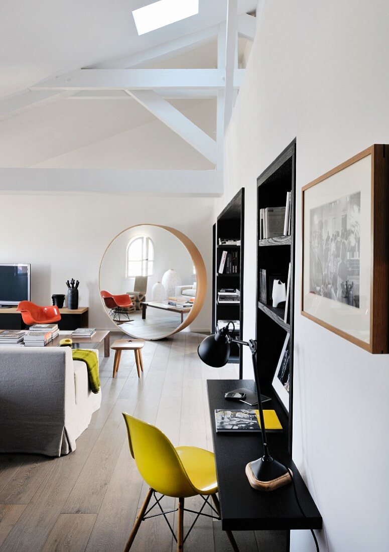 Large round designer mirror in lounge area