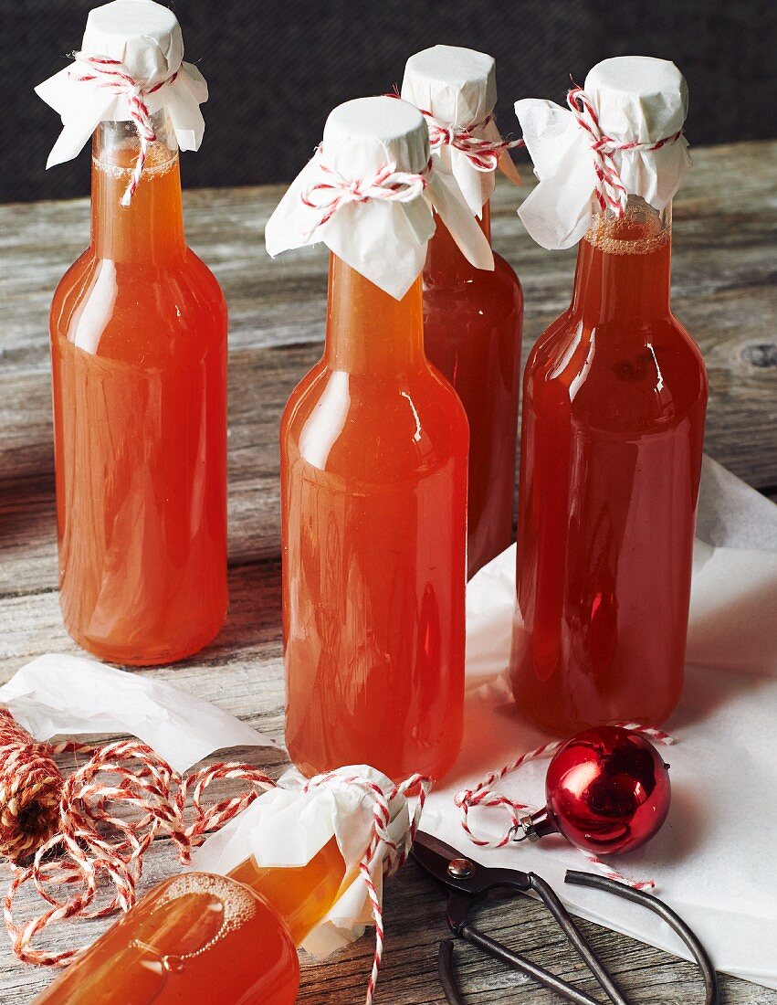 Bottles of homemade quince syrup