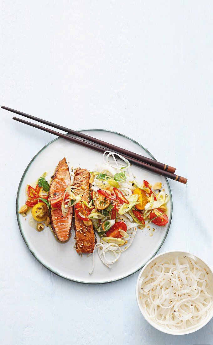 Salmon teriyaki with a cherry tomato, spring onion and rice noodle salad