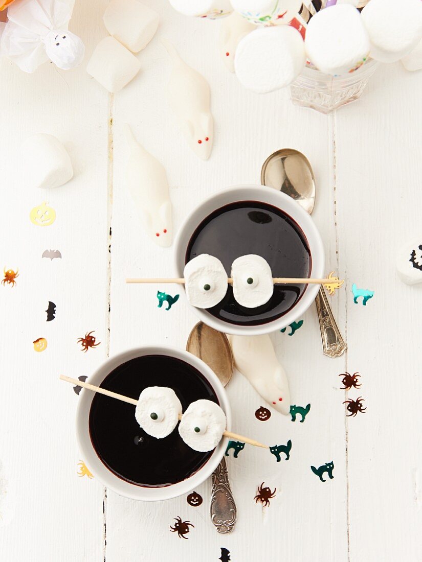 Elderberry soup decorated with marshmallow eyes