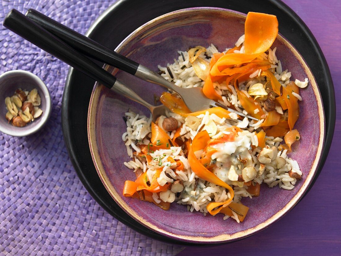 Fried carrot rice with hazelnuts and gorgonzola