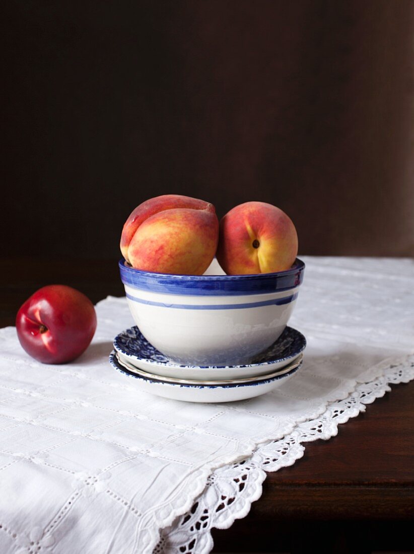 An arrangement of peaches and a nectarine