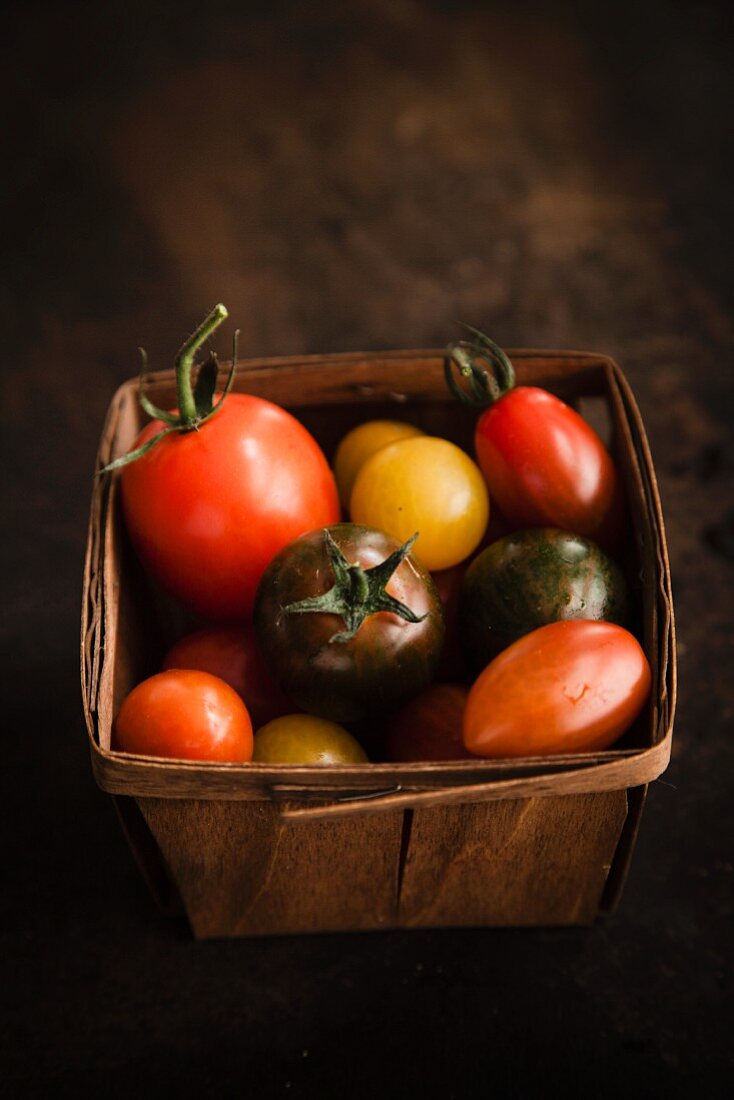 Colourful tomatoes in a basket