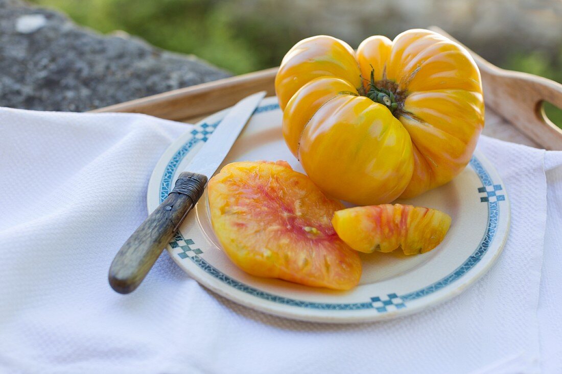 A plate of yellow tomatoes