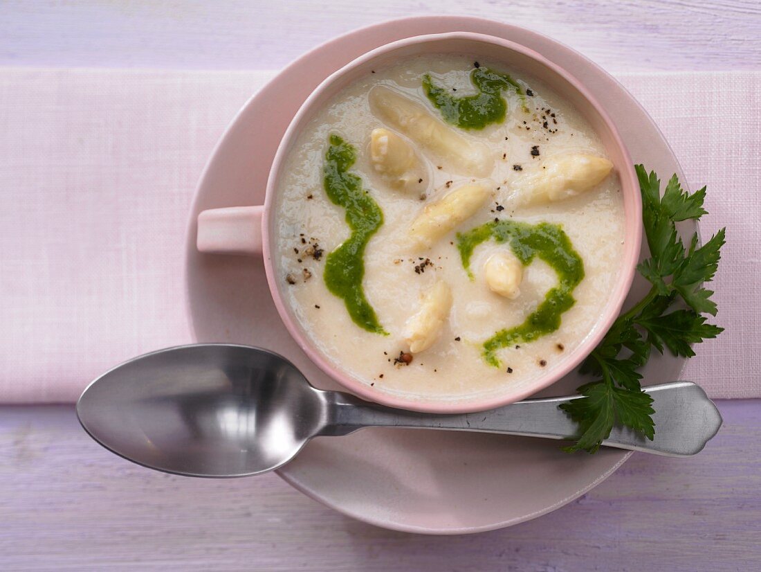 Creamy asparagus soup with parsley oil