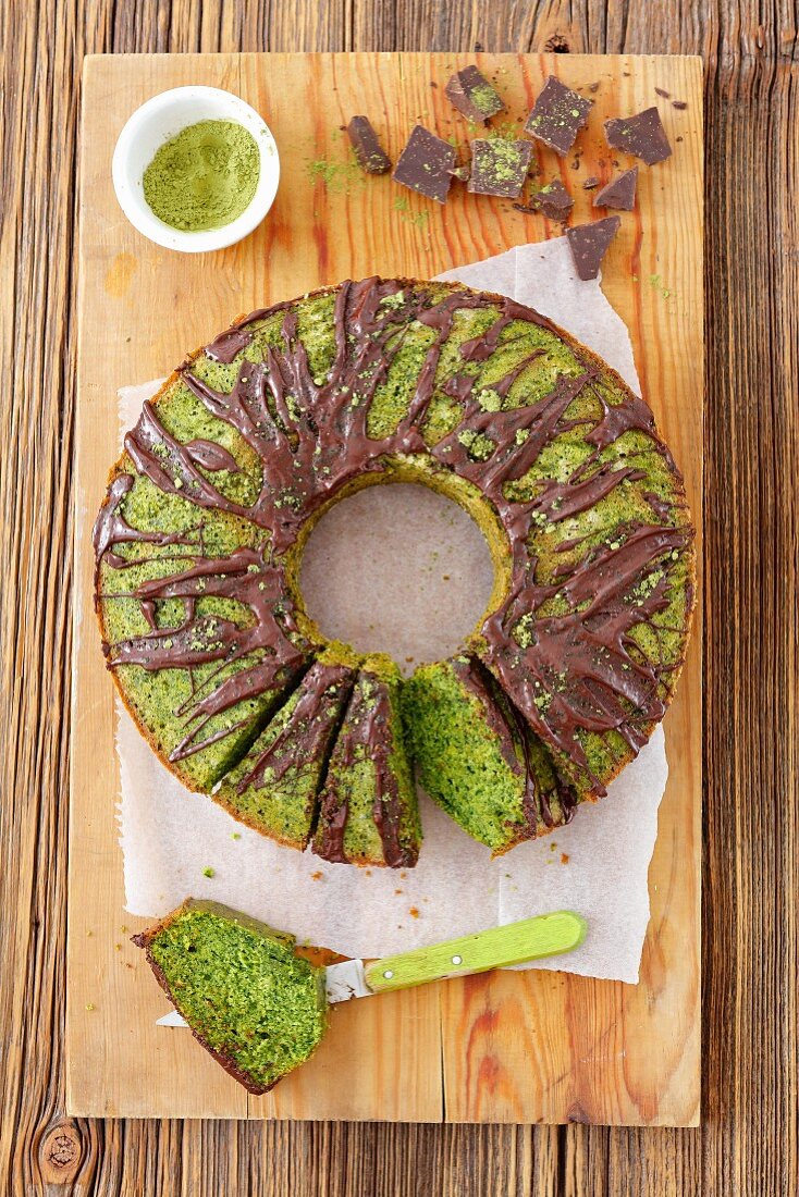 Sweet spinach cake with matcha tea and chocolate glaze