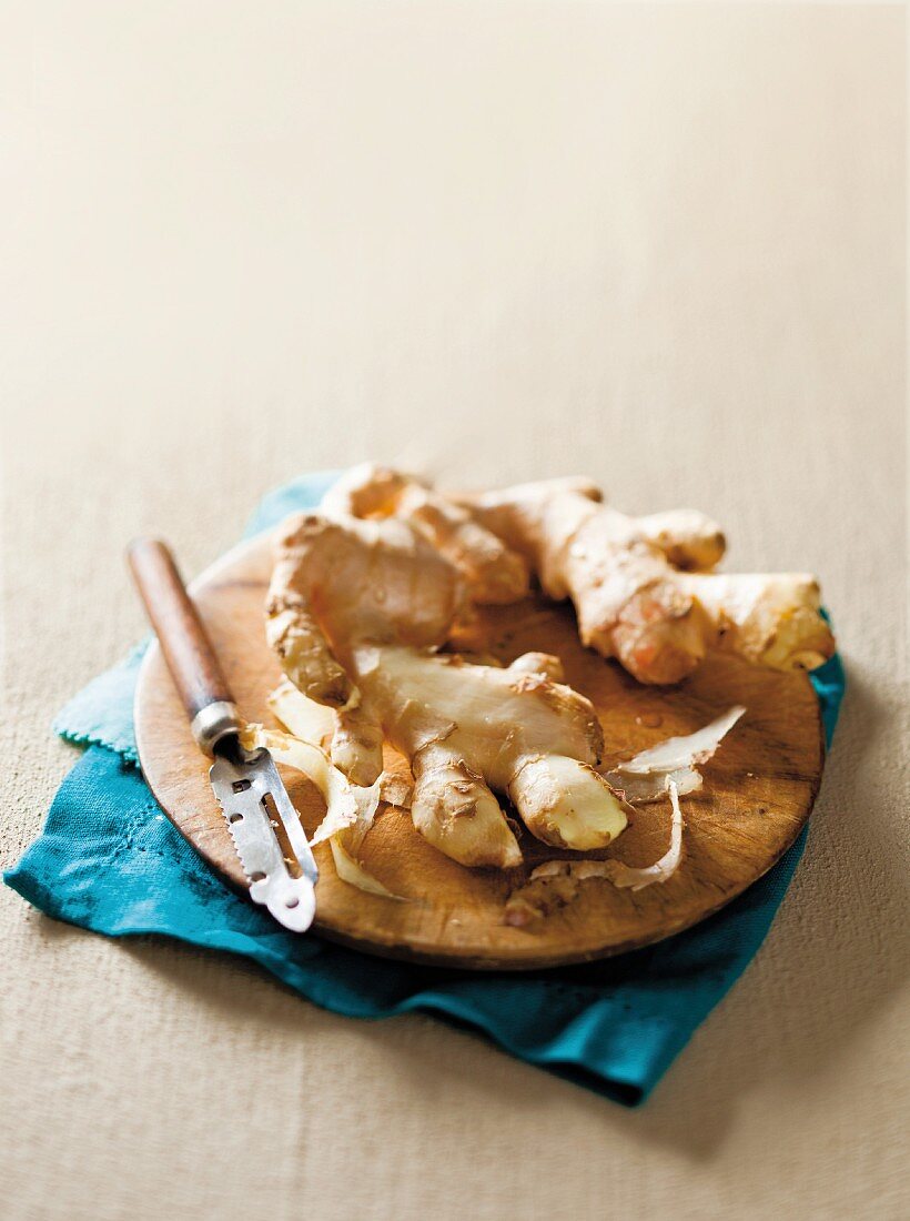 Fresh ginger on a wooden board