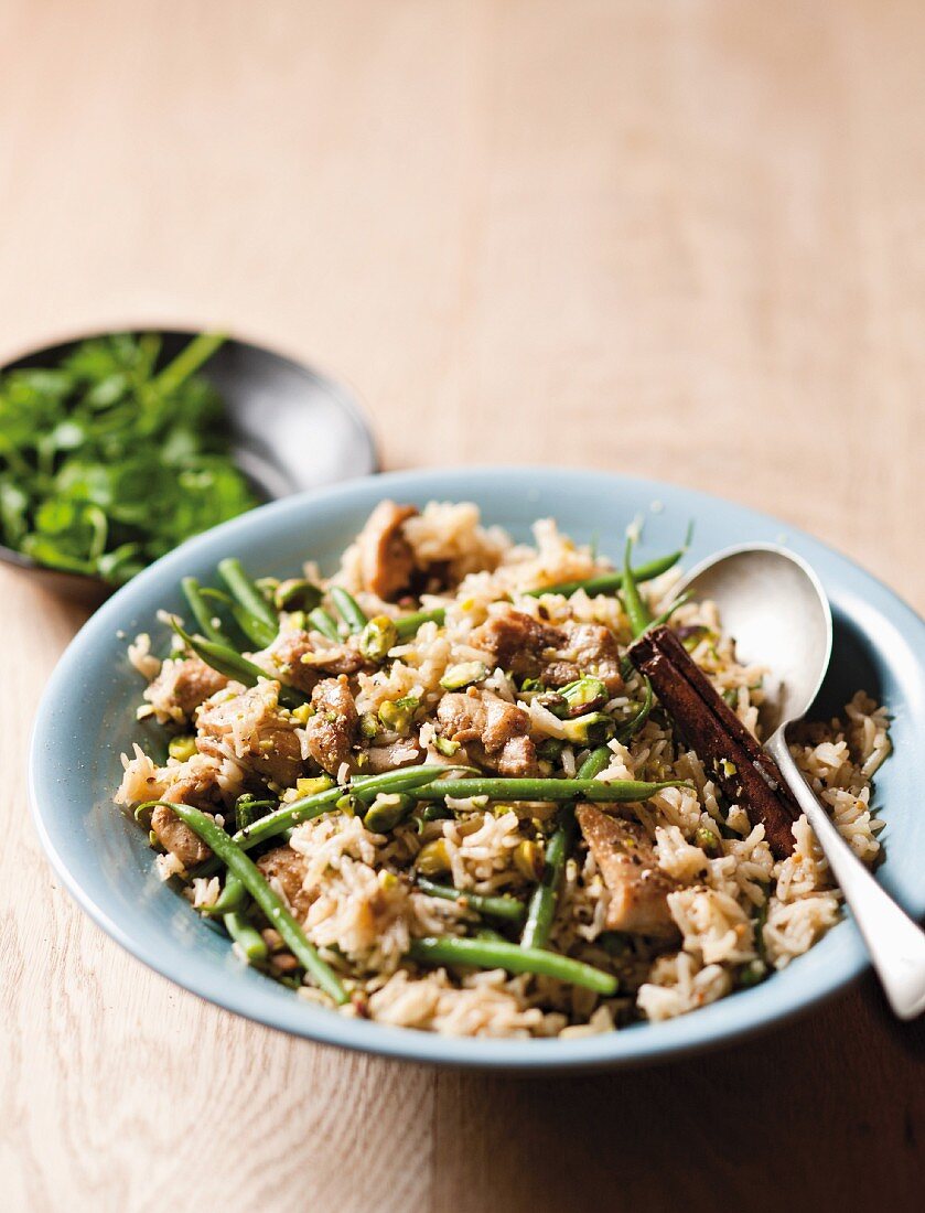 Chicken pilaf with cinnamon, pickled lemons and green beans