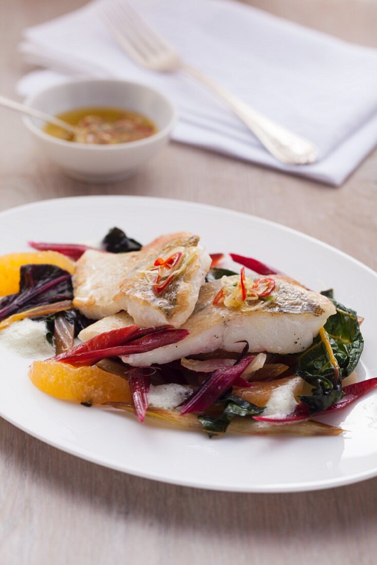 Fillet of fish with chard and orange segments