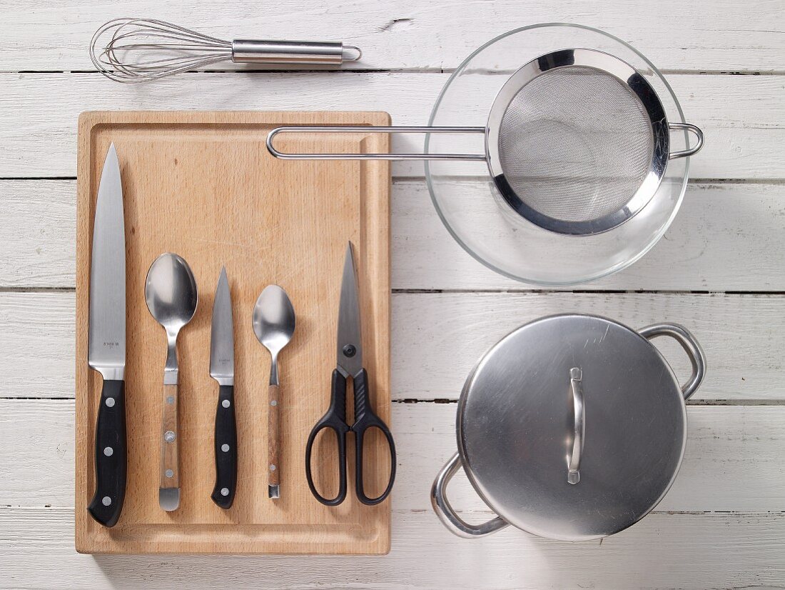 Kitchen utensils for preparing herring and green bean salad