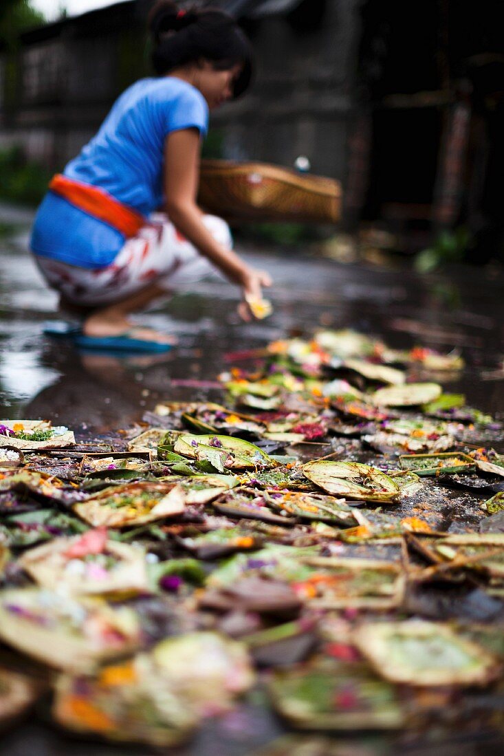 A lady giving her daily offering in Bali, Indonesia, Asia