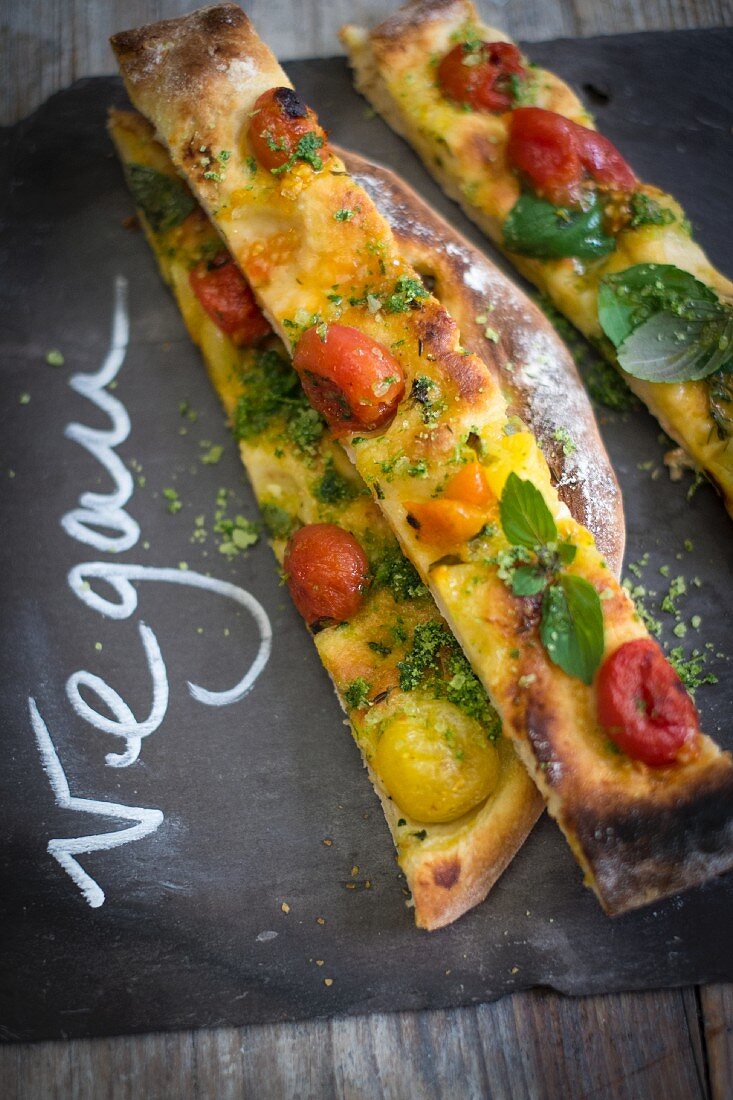Vegan pizza with caramelised tomatoes and basil salt
