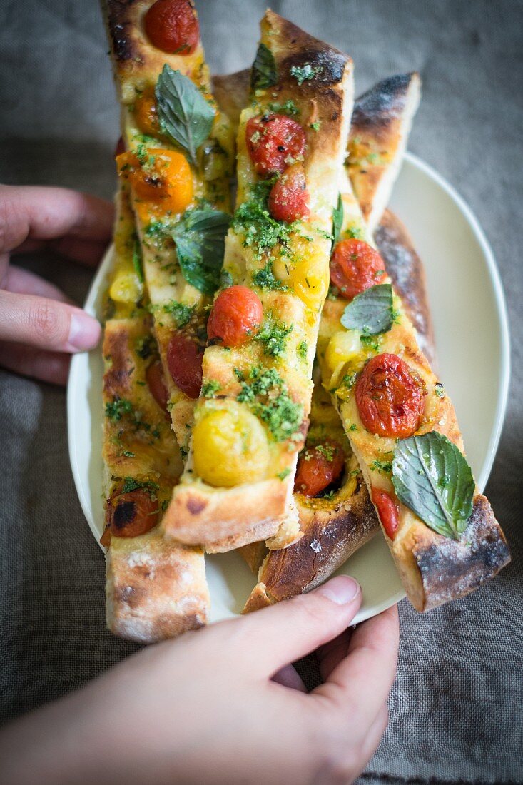 Vegan pizza with caramelised tomatoes and basil salt