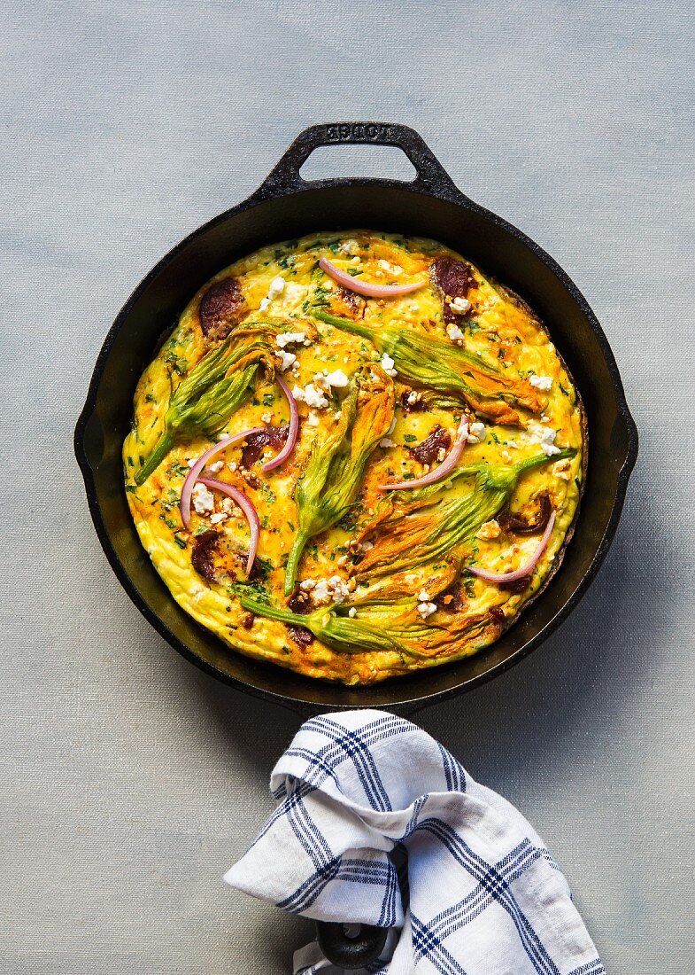 Frittata with courgette flowers, chorizo and cream cheese