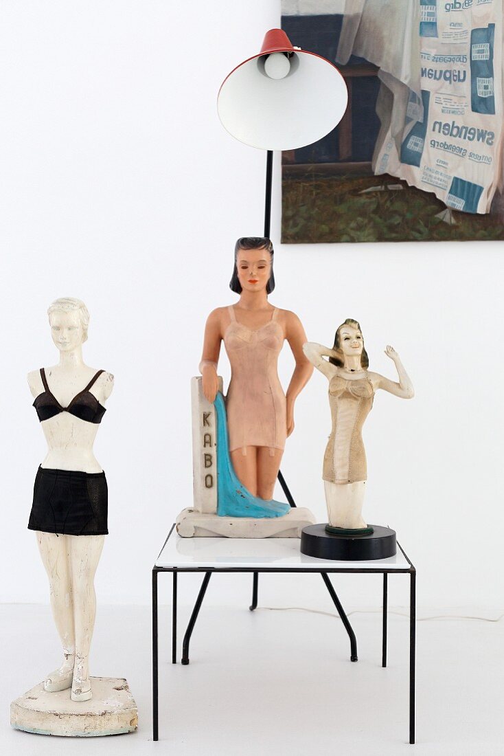 Three retro-style figurines of women