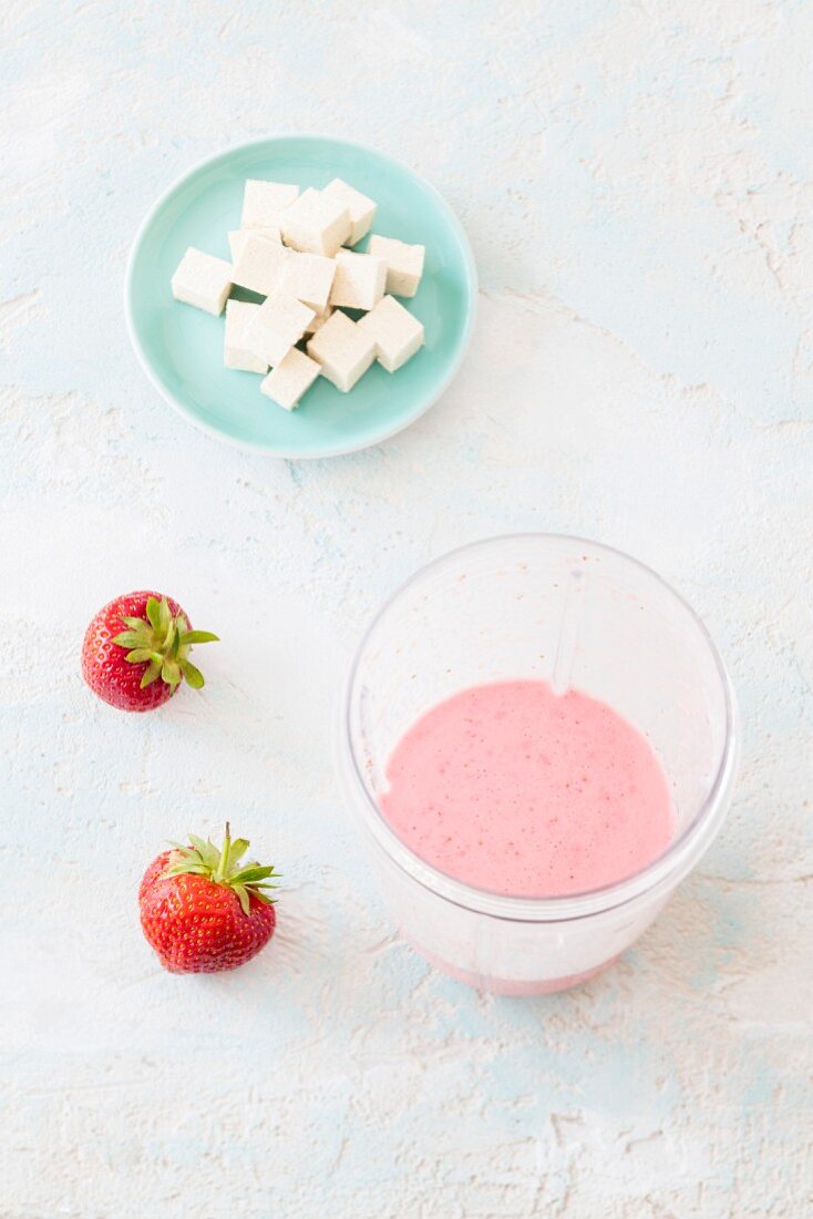 Vegan strawberry smoothie with soya milk and silk tofu