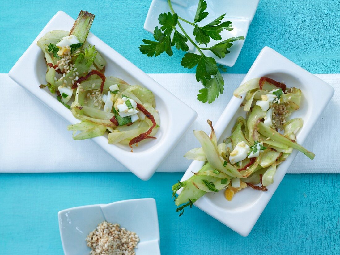 Fennel salad with parsley and egg vinaigrette and sesame seeds