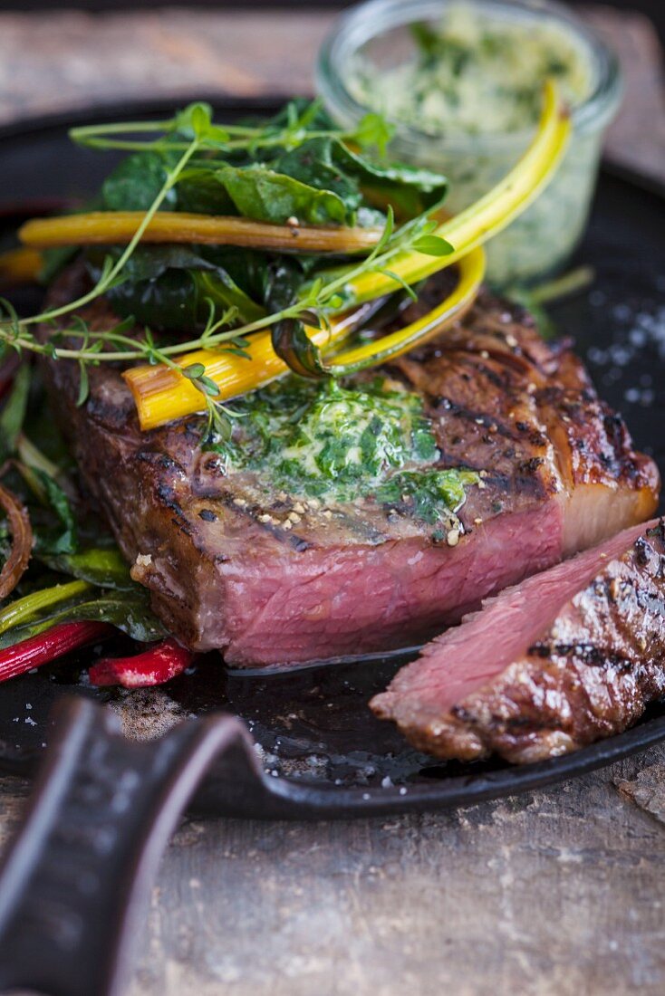 Beef steak with herb butter and colourful chard