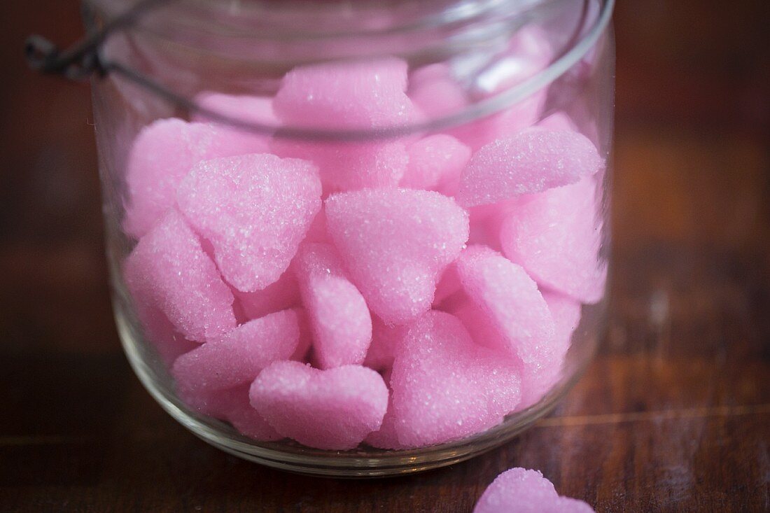 Pink sugar hearts in a glass jar