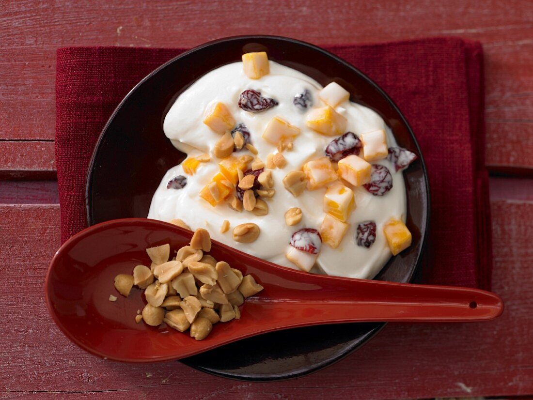 Coconut and mango quark with cranberries and peanuts