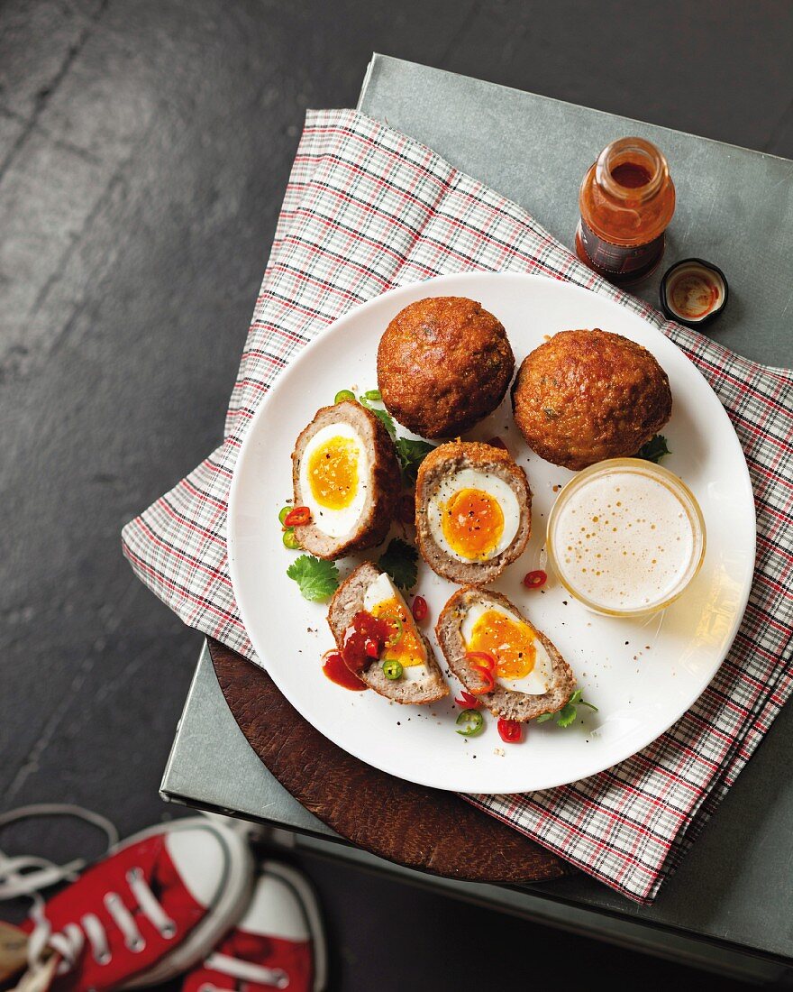 Scotch eggs with hot sauce