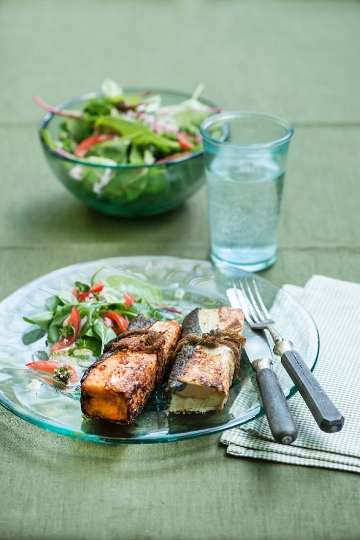 Fish parcels with cod and salmon served with Asian salad