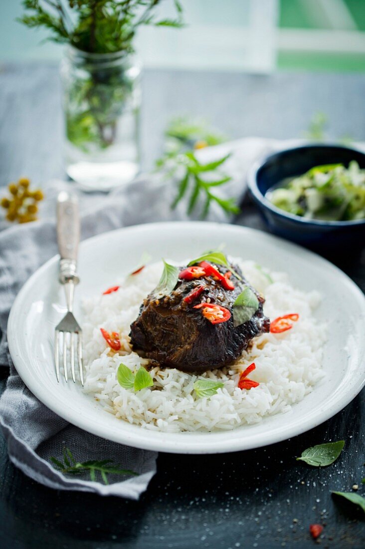 Marinated beef cheeks with chilli on a bed of rice