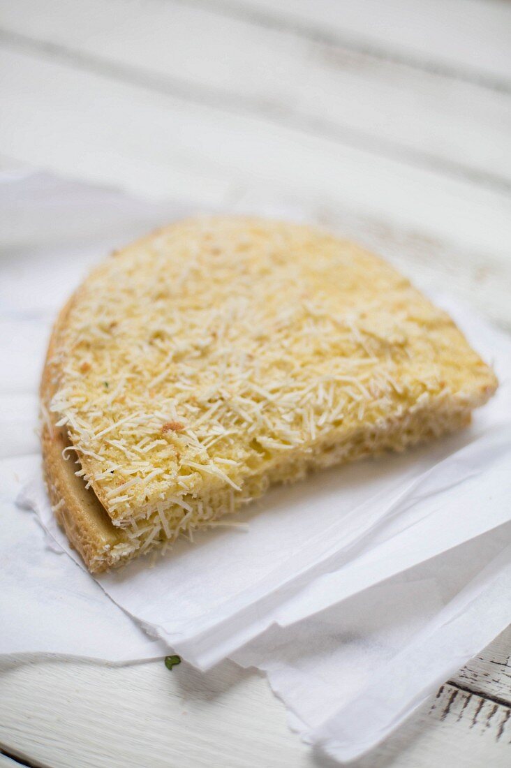 Mozzarella in carozza (Italian fried mozzarella sandwich) sprinkled with cheese