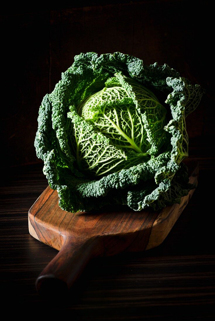Savoy cabbage on a chopping board