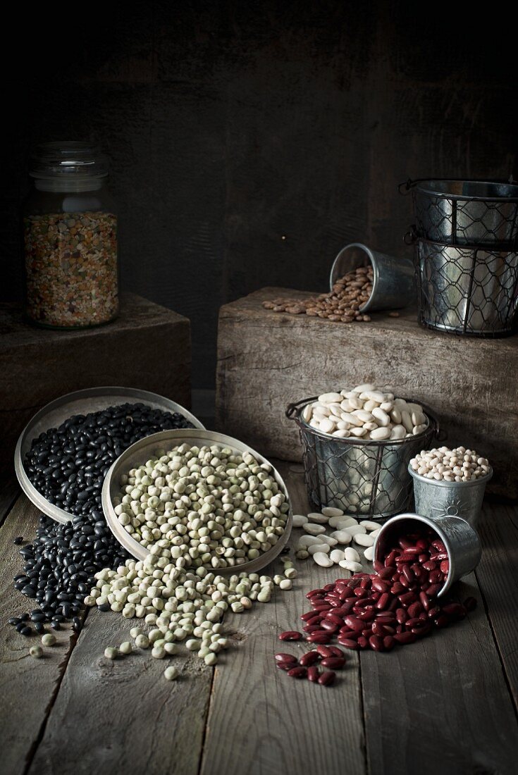 Assorted types of beans in containers