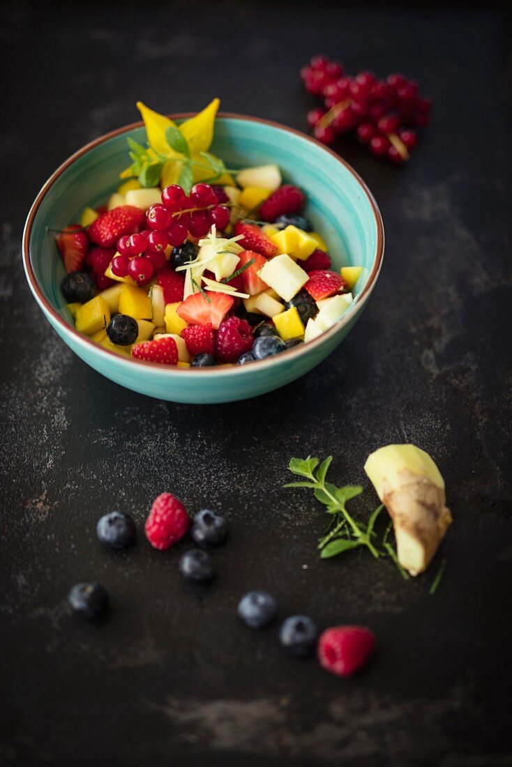 Colourful fruit salad with ginger