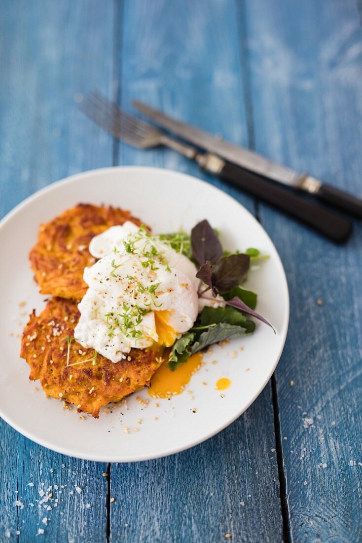 Sweet potato fritters with egg and sesame seeds