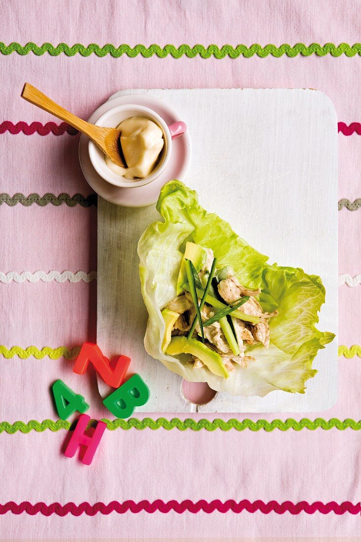 Lettuce wraps with chicken, avocado, spring onion, cucumber and mayonnaise