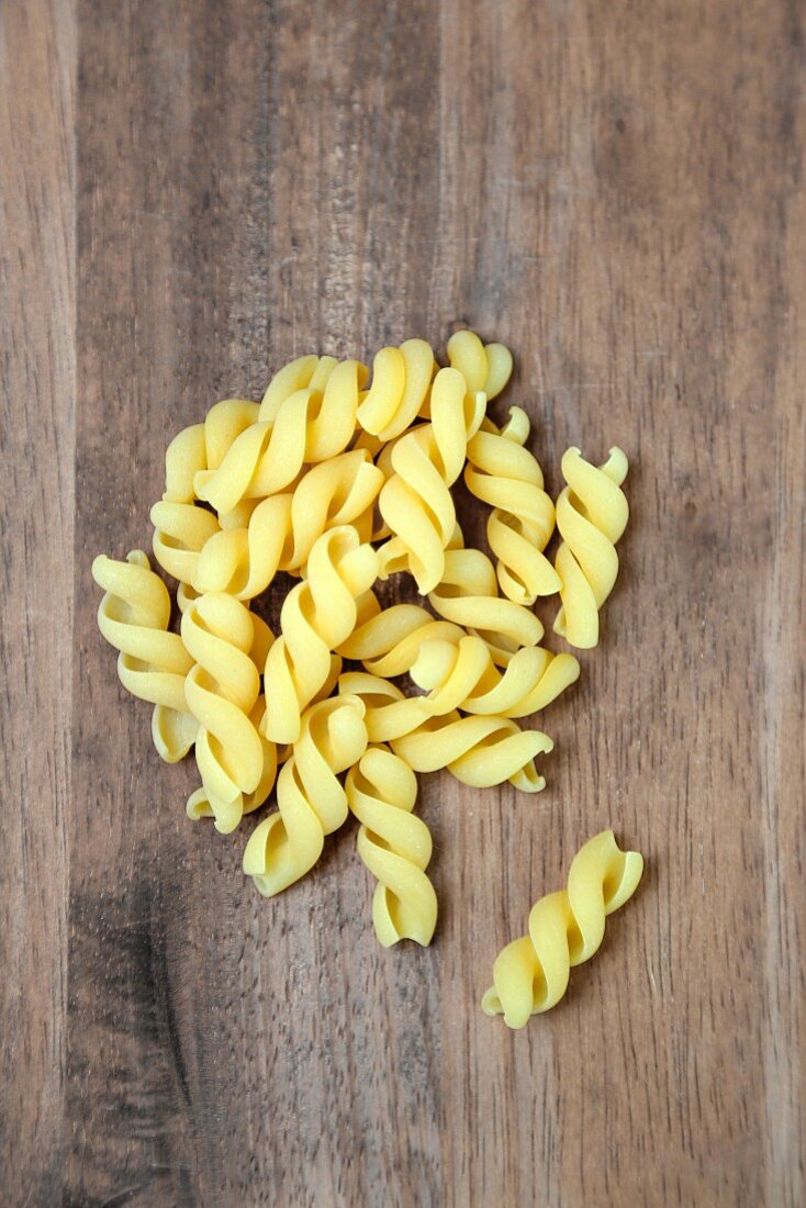 Maxi fusilli on a wooden surface