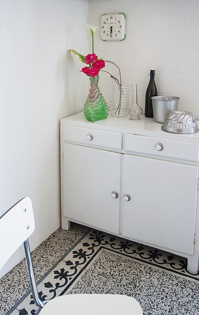 Old cabinet and terrazzo floor in white kitchen