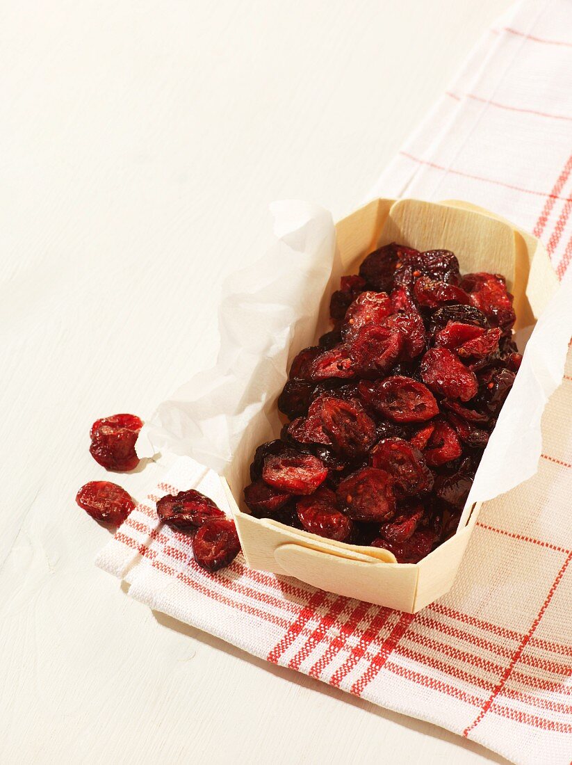 A fruit basket with dried cranberries