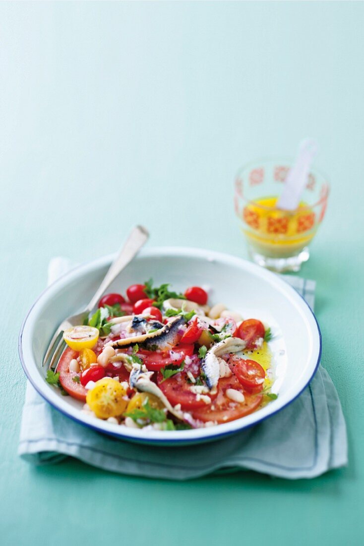 Tomato salad with anchovies and cannellini