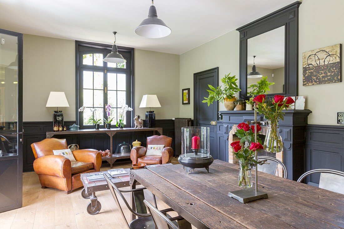 Leather armchairs and rustic tables in living area with traditional ambiance