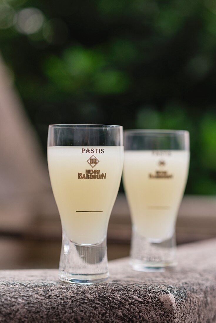 Glasses containing pastis made by Henri Bardouin in Forcalquier, France