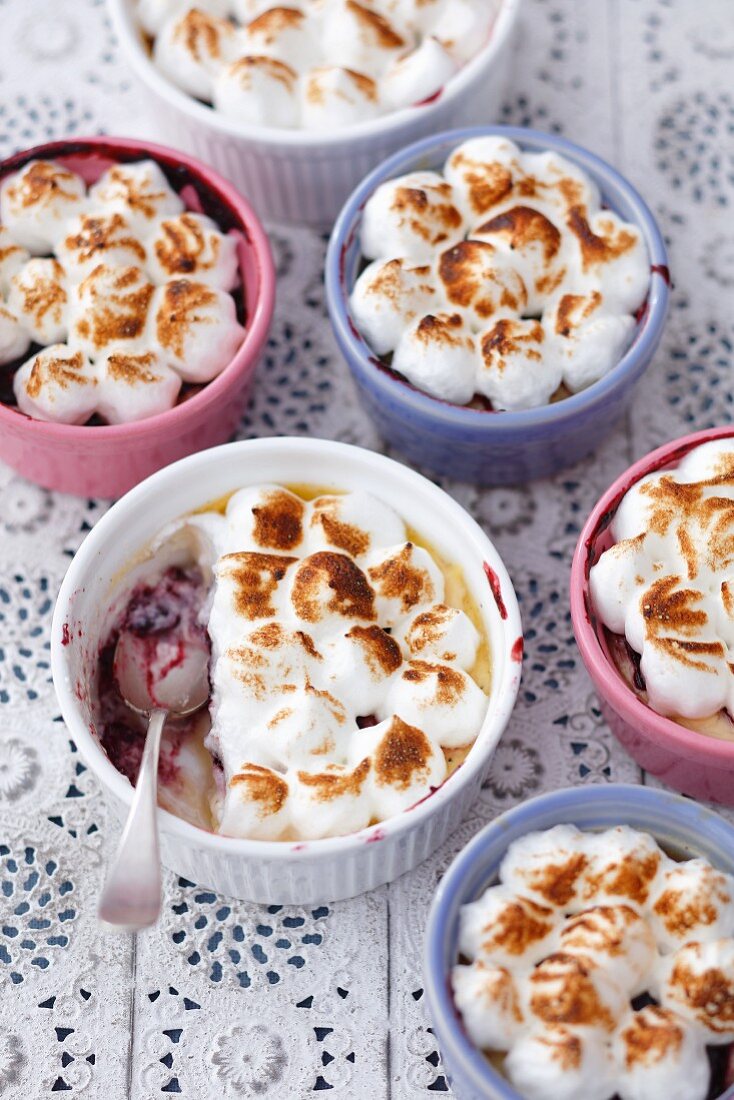 Pudding with redcurrant jam and a toasted meringue topping