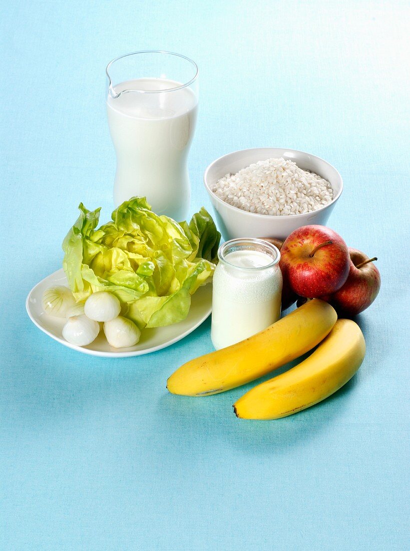 An arrangement of fruit, vegetables and dairy products