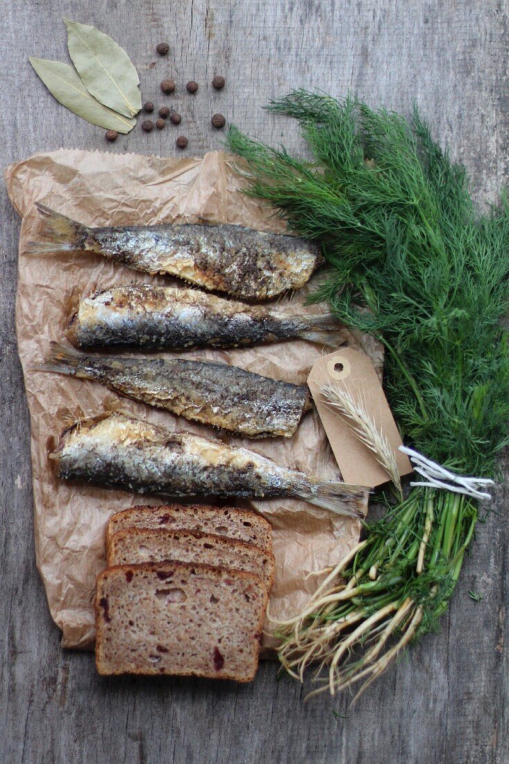 Fried herrings, bread, dill and spices