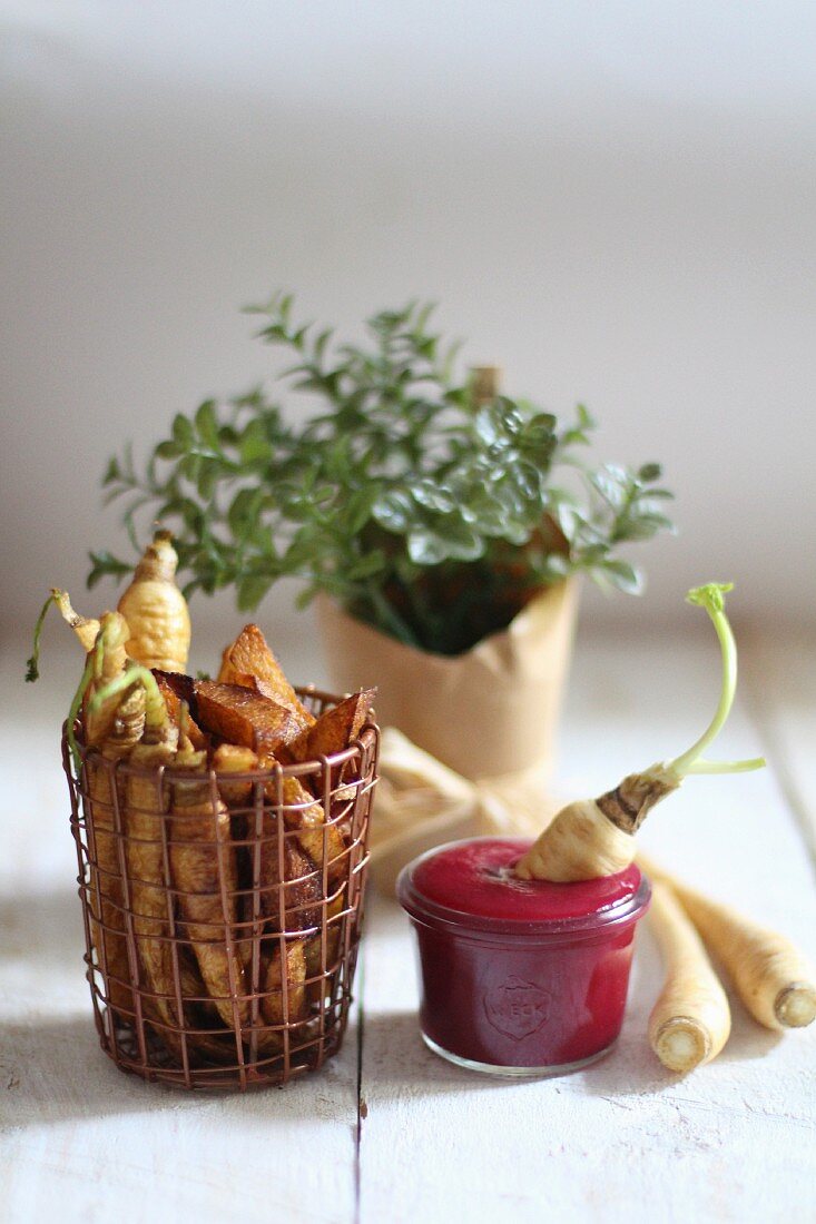 Home-made chips with ketchup and root vegetables