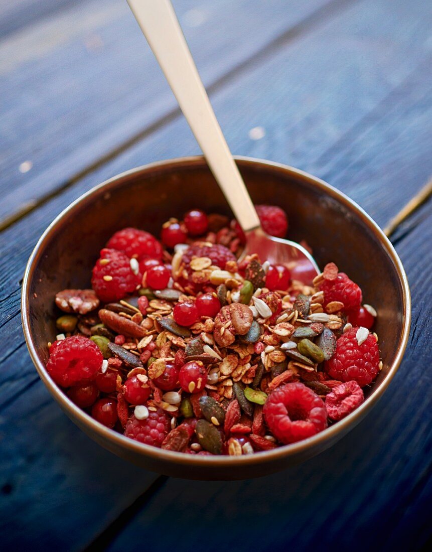 Museli with red berries, pistachios and pumpkin seeds