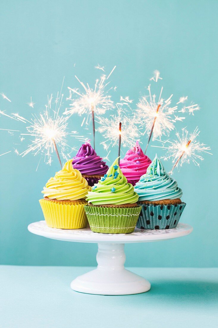 Colorful cupcakes decorated with sparklers