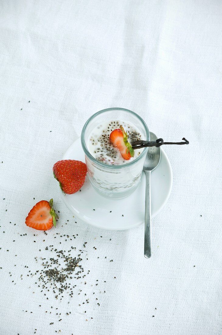Chia pudding with fresh strawberries and a vanilla pod